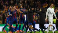 Barcelona players celebrate their victory during the UEFA Champions League round of 16 second leg football match FC Barcelona vs Paris Saint-Germain FC at the Camp Nou stadium in Barcelona on March 8, 2017. (AFP / LLUIS GENE)
