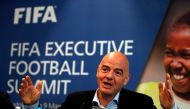 FIFA President Gianni Infantino gestures while talking with journalists during a press conference following the FIFA Executive Football Summit near Heathrow airport in London on March 9, 2017.   AFP / ADRIAN DENNIS
