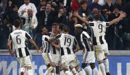 Paulo Dybala (3rdL) celebrates with teammates after scoring during the Italian Serie A football match Juventus Vs AC Milan on March 10, 2017 at the 'Juventus Stadium' in Turin. / AFP / Marco BERTORELLO
