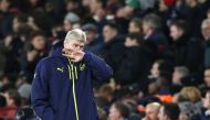 Arsenal's French manager Arsene Wenger reacts during the UEFA Champions League last 16 second leg football match between Arsenal and Bayern Munich at The Emirates Stadium in London on March 7, 2017. / AFP / IKIMAGES / Ian KINGTON
