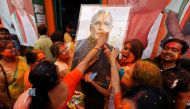 Supporters of the Bharatiya Janata Party (BJP) celebrate after learning of the initial poll results outside the party headquarters in Kolkata, India, March 11, 2017. (REUTERS/Rupak De Chowdhuri)