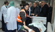 A handout picture released by the Syrian Arab News Agency (SANA) on March 11, 2017 shows a wounded man on stretcher at a hospital in the capital Damscus following a bomb attack.