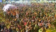 People celebrating Holi in Mathura, Uttar Pradesh, yesterday. Holi is observed in India at the end of the winter season on the last full moon of the lunar month. 