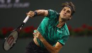 Roger Federer of Switzerland serves during his straight sets victory against Stephane Robert of France in their second round match during day seven of the BNP Paribas Open at Indian Wells Tennis Garden on March 12, 2017 in Indian Wells, California. Clive 