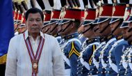 Philippine President Rodrigo Duterte walks past cadets to attend graduation ceremonies at the Philippine Military Academy in Baguio city, in northern Philippines March 12, 2017. REUTERS/Harley Palangchao