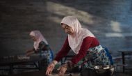 FILE PHOTO: Chinese Muslims prepare a free meal to be served for Iftar, after Friday prayers at the Niujie mosque during the holy month of Ramadan in Beijing on July 1, 2016 (AFP) 