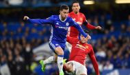 Chelsea's Belgian midfielder Eden Hazard (L) vies with Manchester United's Argentinian defender Marcos Rojo during the English FA Cup quarter final football match between Chelsea and Manchester United at Stamford Bridge in London on March 13, 2017.   AFP 