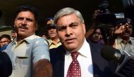 (FILES) This file photo taken on October 19, 2015 shows Shashank Manohar, the then-Board of Control for Cricket in India (BCCI) president and more recently the International Cricket Council (ICC) chairman, being escorted out of the Indian cricket board's 