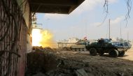 A tank of Iraqi rapid response forces fires against Islamic State militants at the Bab al-Tob area in Mosul, Iraq, March 14, 2017. REUTERS/Ari Jalal 