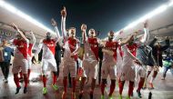 Monaco's players celebrate at the end of the UEFA Champions League round of 16 football match between Monaco and Manchester City at the Stade Louis II in Monaco on March 15, 2017. / AFP / Valery HACHE
