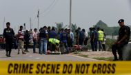 Crime Scene Unit works on the spot where police shot dead a suspected militant who tried to enter a security checkpost on a motorcycle armed with explosives in Khilgaon, outskirt of Dhaka, Bangladesh, March 18, 2017. REUTERS/Mohammad Ponir Hossain
