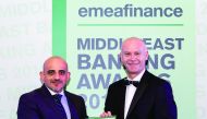 Doha Bank official receiving the award.