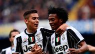 Juventus' Colombian forward Juan Cuadrado (R) celebrates with Juventus' Argentinian forward Paulo Dybala after scoring a goal during the Italian Serie A football match Sampdoria versus Juventus on March 19, 2017 at the Luigi Ferraris stadium in Genova. / 