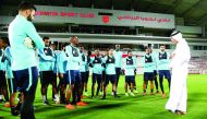 Qatar Football Association (QFA) President Sheikh Hamad bin Khalifa bin Ahmed Al Thani talks to the national team players during a training session at Lekhwiya Stadium on Saturday.