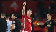 (FILES) This file photo taken on January 29, 2017 shows Manchester United's German midfielder Bastian Schweinsteiger (C) saluting the crowd at the end of the English FA Cup fourth round football match between Manchester United and Wigan Athletic at Old Tr