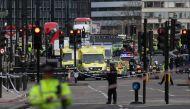 A man mowed down pedestrians on a bridge near the British parliament and stabbed a policeman on Wednesday, killing three people before being shot and killed by police.