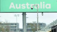 Mercedes British driver Lewis Hamilton motoring through the pits at the Formula One Australian Grand Prix in Melbourne in this March 18, 2016 file photo. 