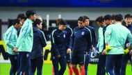 South Korean players gather for a training session on the eve of their World Cup football qualifying match against China in Changsha, China's central Hunan province.