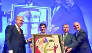 H E Dr Hamad bin Abdulaziz Al Kawari being honoured by officials at the Eurasia Higher Education Summit in Istanbul.