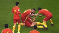 Chinese players celebrate after Yu Dabao (top C) scored during their World Cup football qualifying match against South Korea in Changsha, China's central Hunan province, on March 23, 2017. / AFP / GREG BAKER
