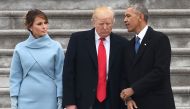 US President Donald Trump speaks to former President Barack Obama as First Lady Melania Trump looks on after inauguration ceremonies at the US Capitol on January 20, 2017 in Washington (AFP / Robyn BECK) 