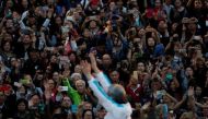People attend an election campaign by candidate John Tsang, former Financial Secretary, at the financial Central district, two days before the Chief Executive election, in Hong Kong, China March 24, 2017. REUTERS/Bobby Yip