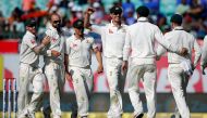 Australia's Nathan Lyon (2-L) celebrates with his team-mates after dismissing India's captain Ajinkya Rahane. (Reuters/Adnan Abidi)