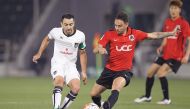 Al Sadd captain Xavi Hernandez (left) fights for the ball possession during a Qatar Stars League match, against Al Rayyan in this April 2016 file picture.