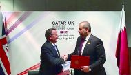 Minister of Economy and Commerce, H E Sheikh Ahmed bin Jassim Al Thani (right) and Dr Liam Fox, Secretary of State for International Trade, UK, during the MoU signging ceremony held on the sideline of Qatar-UK Business and Investment Forum held in Birming