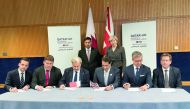 Prime Minister and Interior Minister H E Sheikh Abdullah bin Nasser bin Khalifa Al Thani (standing, left) and UK Prime Minister Theresa May(standing right) attending the signing of a shareholders agreement for Qatar Investment Authority's (QIA) acquisitio