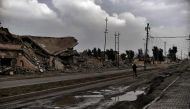 A member of the Nineveh Plain Protection Units (NPU), a small Christian militia charged with protecting the predominantly Christian Iraqi town of Qaraqosh (Hamdaniya), walks down the street in the town which lies some 30 kilometres east of the northern ci