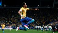 Brazil's forward Neymar celebrates after scoring against Paraguay during their 2018 FIFA World Cup qualifier football match in Sao Paulo, Brazil on March 28, 2017. / AFP / Miguel SCHINCARIOL

