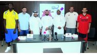 Qatar Basketball Federation  (QBF)Secretary General Ali Al Malki and  other officials pose for a photograph with Al Rayyan and Al Gharafa captains and coaches during a press conference held ahead of the final of the Qatar Cup Basketball Tournament. RIGHT: