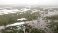 Flooded areas can be seen from an Australian Army helicopter after Cyclone Debbie passed through the area near the town of Bowen, located south of the northern Queensland town of Townsville in Australia, March 30, 2017. REUTERS/Gary Ramage/Pool
