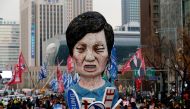 Members of Korean Confederation of Trade Unions march with an effigy of President Park Geun-hye during a general strike calling for Park to step down in central Seoul, South Korea, November 30, 2016 (REUTERS) 