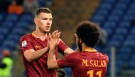 AS Roma's Bosnian forward Edin Dzeko (L) celebrates with AS Roma's Egyptian midfielder Mohamed Salah after scoring a goal during the Italian Serie A football match AS Roma versus Empoli on April 1, 2017 at Rome's Olympic stadium. / AFP / ANDREAS SOLARO
