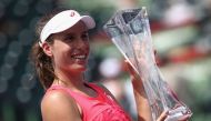 Johanna Konta of Great Britain celebrates with the trophy after defeating Caroline Wozniacki of Denmark in the final at Crandon Park Tennis Center on April 1, 2017 in Key Biscayne, Florida. Julian Finney/AFP
