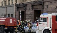 Emergency services personnel walk at the entrance to Technological Institute metro station in Saint Petersburg on April 3, 2017.  AFP / Olga MALTSEVA
