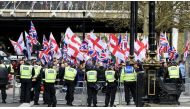 Supporters of Britain First and EDL (English Defence League) stage a pro-fascist protest as supporters of 'Unite against Fascism', an anti-fascist pressure group hold a counter-protest in Trafalgar square in London, England, United Kingdom on April 01, 20