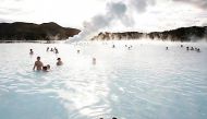 Bathers swim in the geothermal hot springs at Iceland's Blue Lagoon near Grindavik. Bob Strong / Reuters

