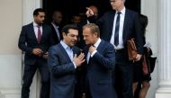 European Council President Donald Tusk (R) speaks with Greek Prime Minister AlexisTsipras as he leaves the Maximos Mansion in Athens, Greece, April 5, 2017. REUTERS/Michalis Karagiannis.