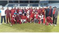Qatar national cricket team players and officials pose for a photograph ahead of their tour to Thailand.