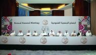 Abdulla bin Fahad bin Ghorab Al Marri (third right), Chairman of the Board of Directors of QFB and other board members at the AGM in Doha yesterday.