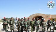 A handout picture released by the official Syrian Arab News Agency (SANA) on April 7, 2017, reportedly shows Syrian Armed Forces' chief of staff, Ali Abdullah Ayyoub (C), visiting Shayrat (