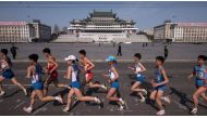 Competitors run through Kim Il-Sung square during the Pyongyang Marathon in central Pyongyang on Apr 9, 2017. (Photo: AFP/Ed Jones).