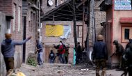 Kashmiri demonstrators (C) throw stones towards Indian policemen during a protest against by-polls in Srinagar April 9, 2017. REUTERS/Danish Ismail