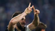 Juventus' forward Gonzalo Higuain from Argentina celebrates after scoring during the Italian Serie A football match Juventus vs Chievo on April 8, 2017 at the Juventus Stadium in Turin. Juventus won the match 2-0. / AFP / Marco BERTORELLO