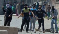 Kashmiri protestors clash with Indian security forces near a polling station in Srinagar on April 9, 2017.   AFP / TAUSEEF MUSTAFA

