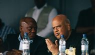 African National Congress Kwa Zulu Natal chair Sihle Zikalala (L) andSouth Africa's sacked finance minister Pravin Gordhan (R) talks during in a memorial for anti apartheid stalwart Ahmed Kathrada on April 9, 2017 in Durban, South Africa. Pravin Gordhan w