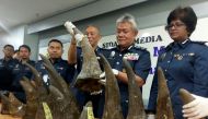 KLIA customs director-general Hamzah Sundang (second from right) poses with rhino horns that were seized on April 7 from Mozambique to Kuala Lumpur via Doha, during a news conference at the airport in Sepang April 10, 2017. — Reuters pic.